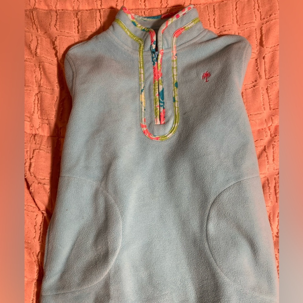 A size 19 blue Lilly Pulitzer jacket with pink green and yellow outline.